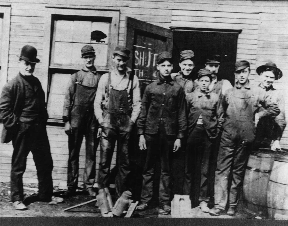 Workers outside the Root Glass Company, circa 1900s. Earl R. Dean stands 4th from right, Alexander Samuelson on far left.